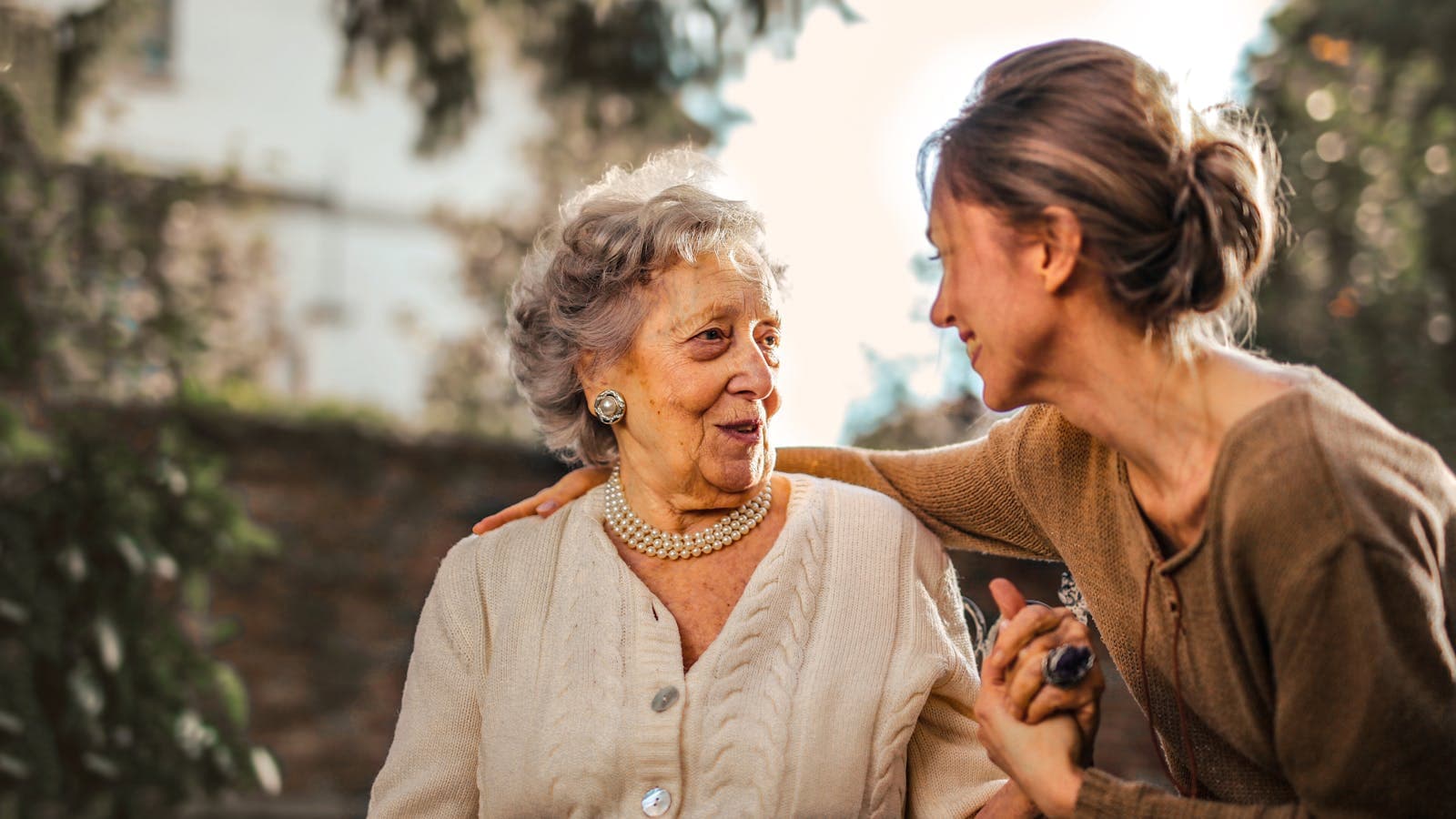 Senior couple walking together outdoors representing the future of connected care